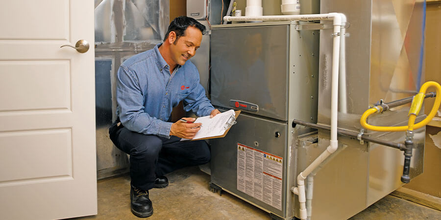 Service Technician inspecting heater